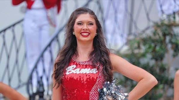 Allison Tarpley poses in her color guard uniform.