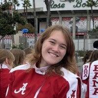 Delaney Woodard wearing her Million Dollar Band uniform and smiling.