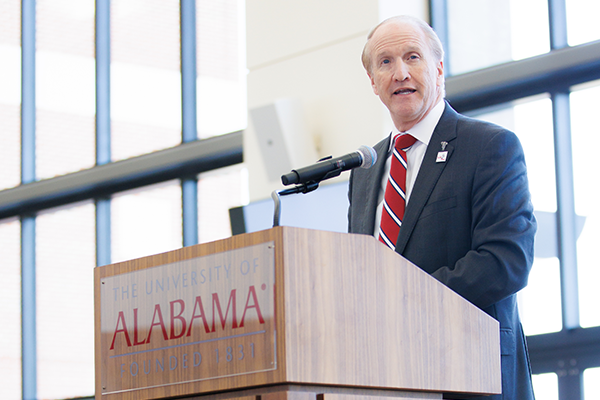 Dr. Bell behind podium